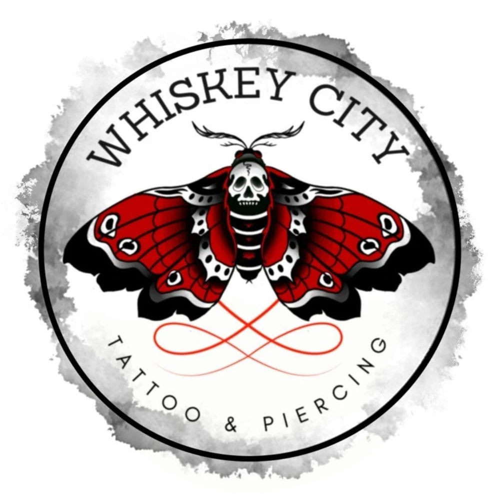 Whiskey City Tattoo & Piercing moth logo