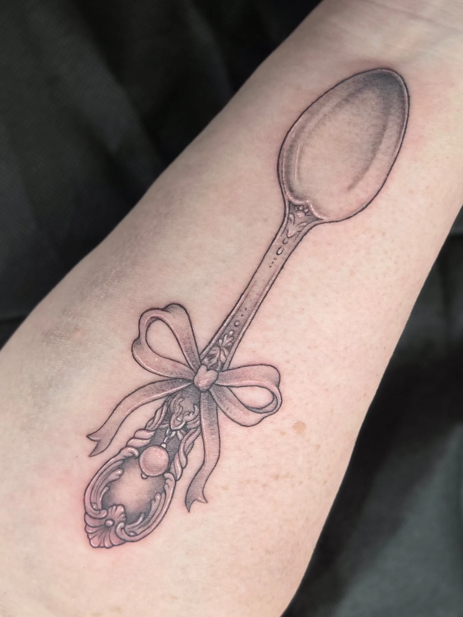 Antique spoon tattoo tied with a bow